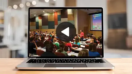 Laptop with video of lecture paused